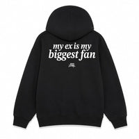 A black pullover hoodie shown from both the front and back on a plain white background. The front has small white text on the left chest reading 'very ex is my biggest fan', and the back has larger white text reading 'my ex is my biggest fan' with a small black graphic below.