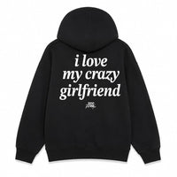 Black pullover hoodie shown from the front and back on a white background. The front has small white text reading 'I love my crazy girlfriend' on the left chest, and the back has large white text reading 'i love my crazy girlfriend' with a small script mark below.