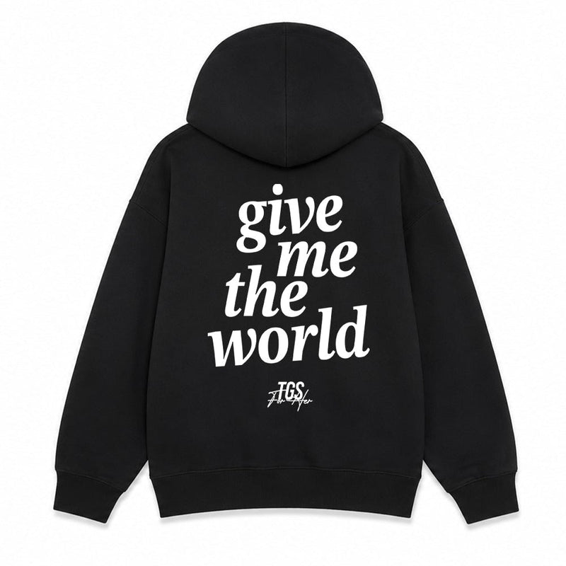 Black pullover hoodie shown from the front and back on a white background. The front has a small white chest print reading 'give me the world' with a small logo below.